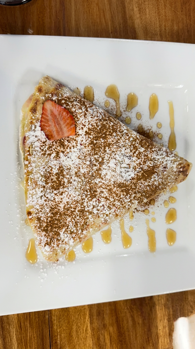 Powdered sugar crêpe with strawberry